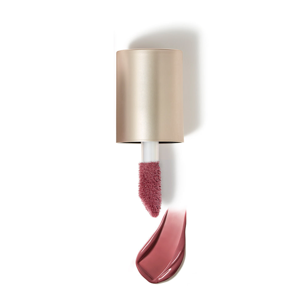 Das Bild zeigt den Applikator des jane iredale Liquid Blush mit dem dazugehörigen Farbton darunter